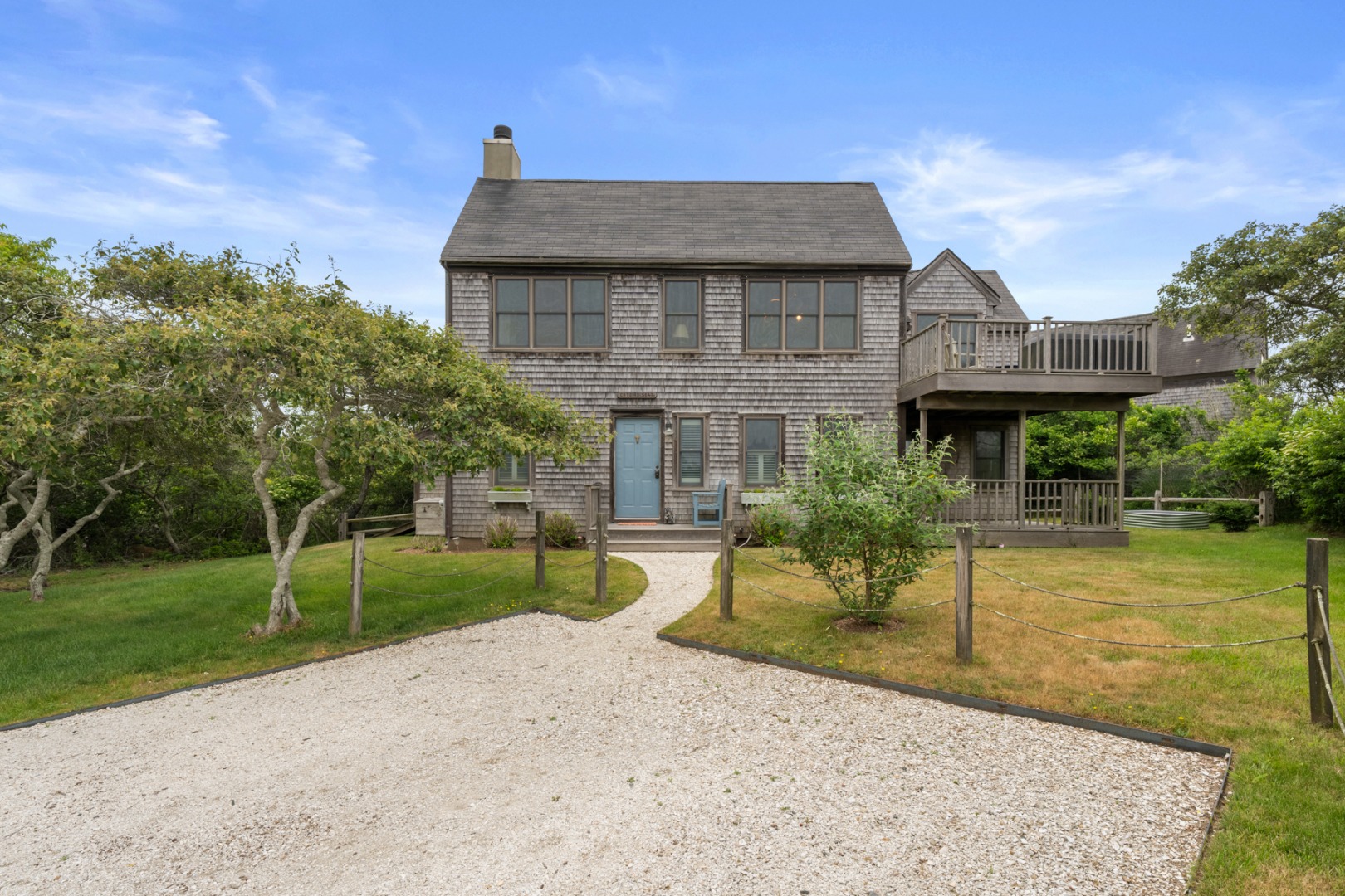 4 Berkley Street Nantucket, MA 02554 - Photo 18 of 47 a front view of a house with a yard