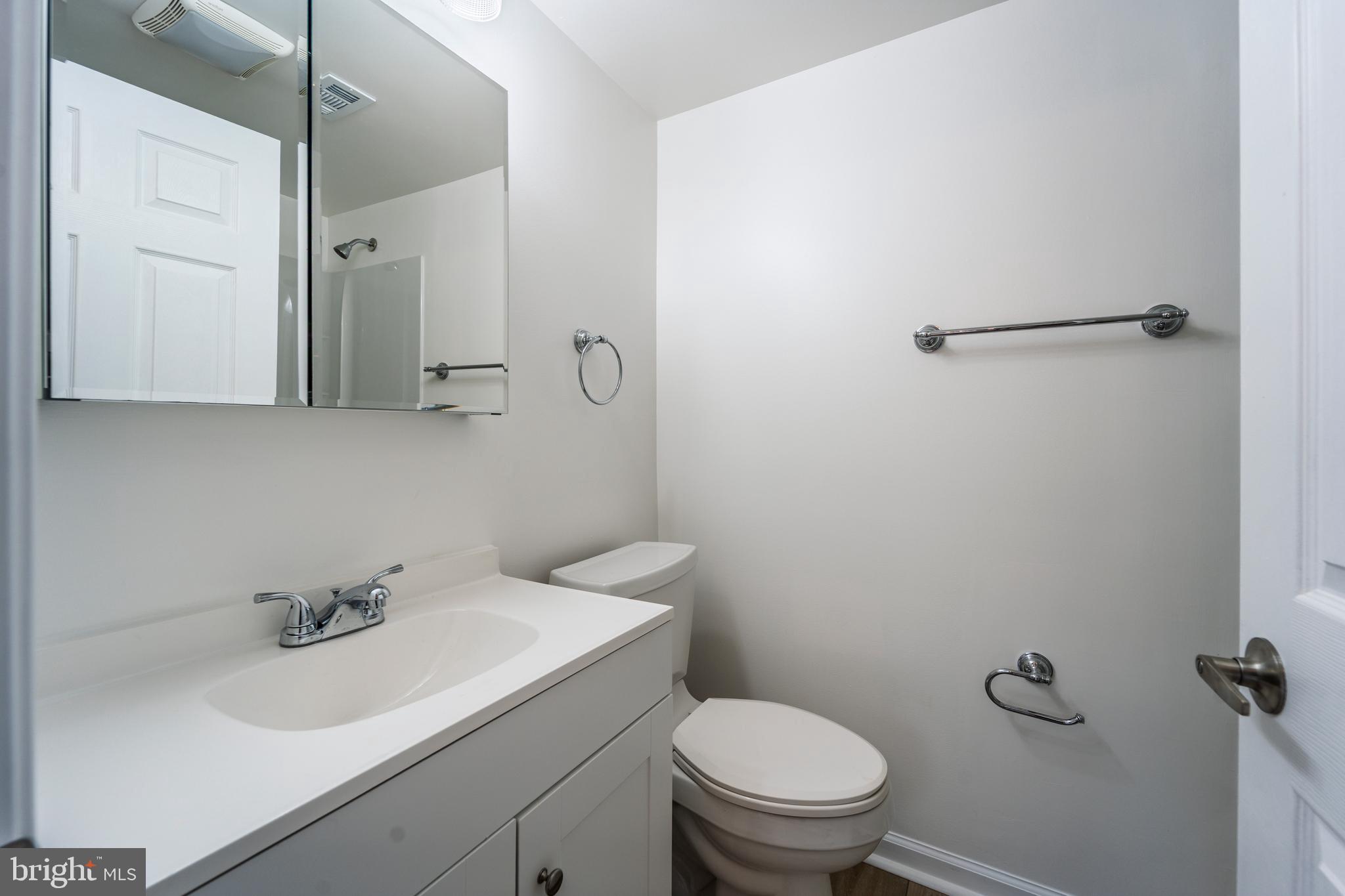 807 Washington Road Westminster, MD 21157 - Photo 12 of 32 a bathroom with a sink a toilet and shower
