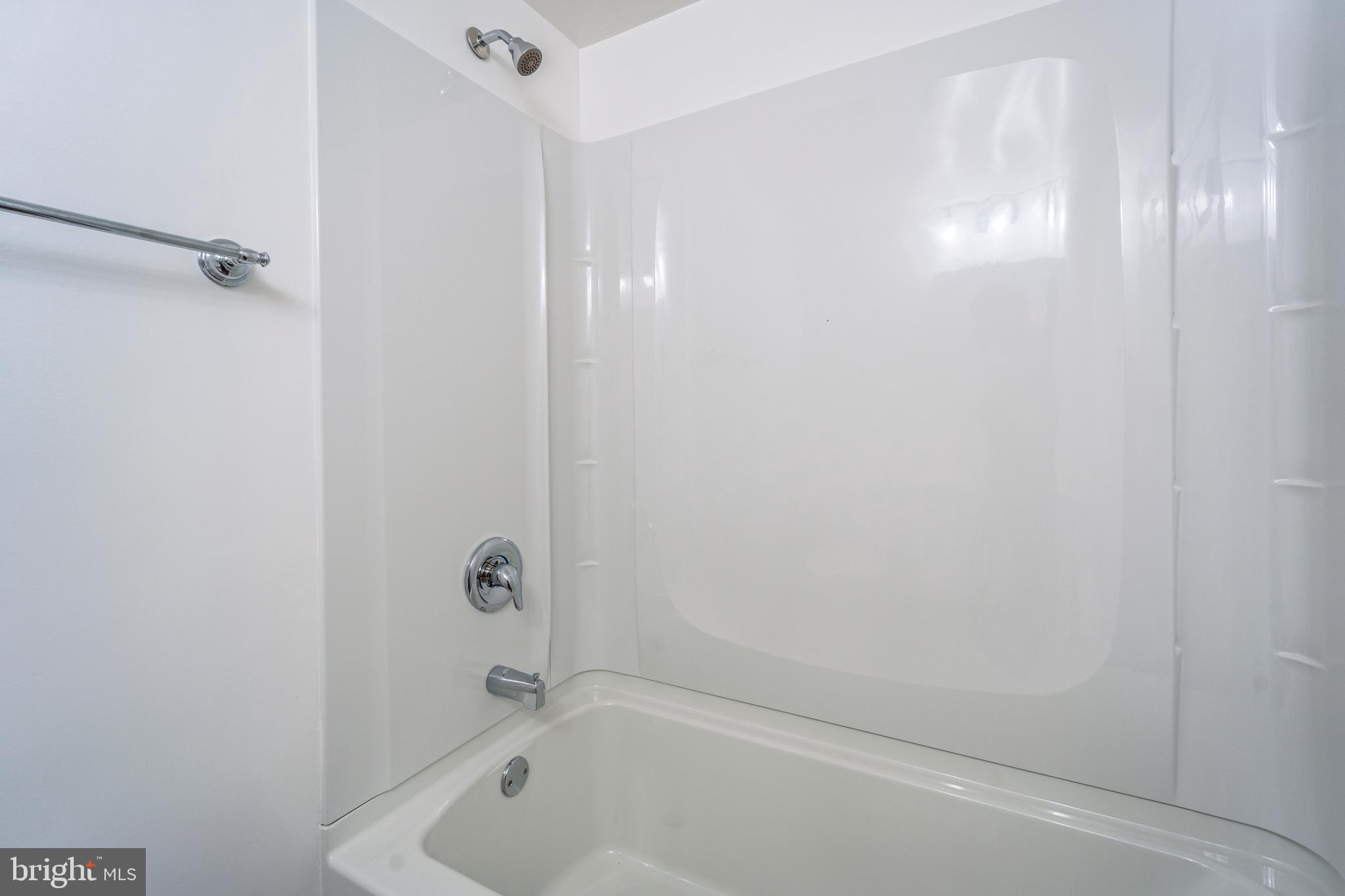 807 Washington Road Westminster, MD 21157 - Photo 13 of 32 a bathroom with a tub and shower