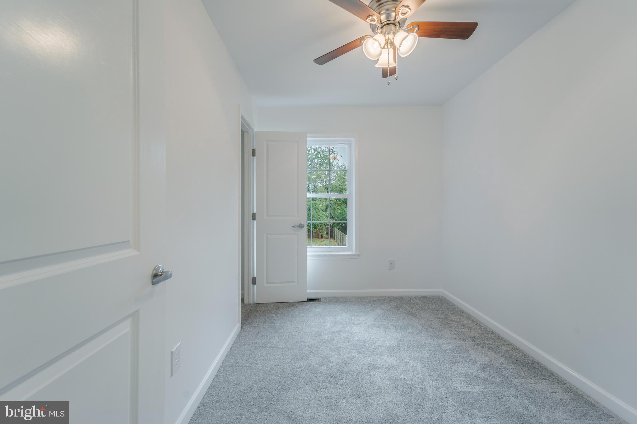 807 Washington Road Westminster, MD 21157 - Photo 19 of 32 an empty room with windows and fan