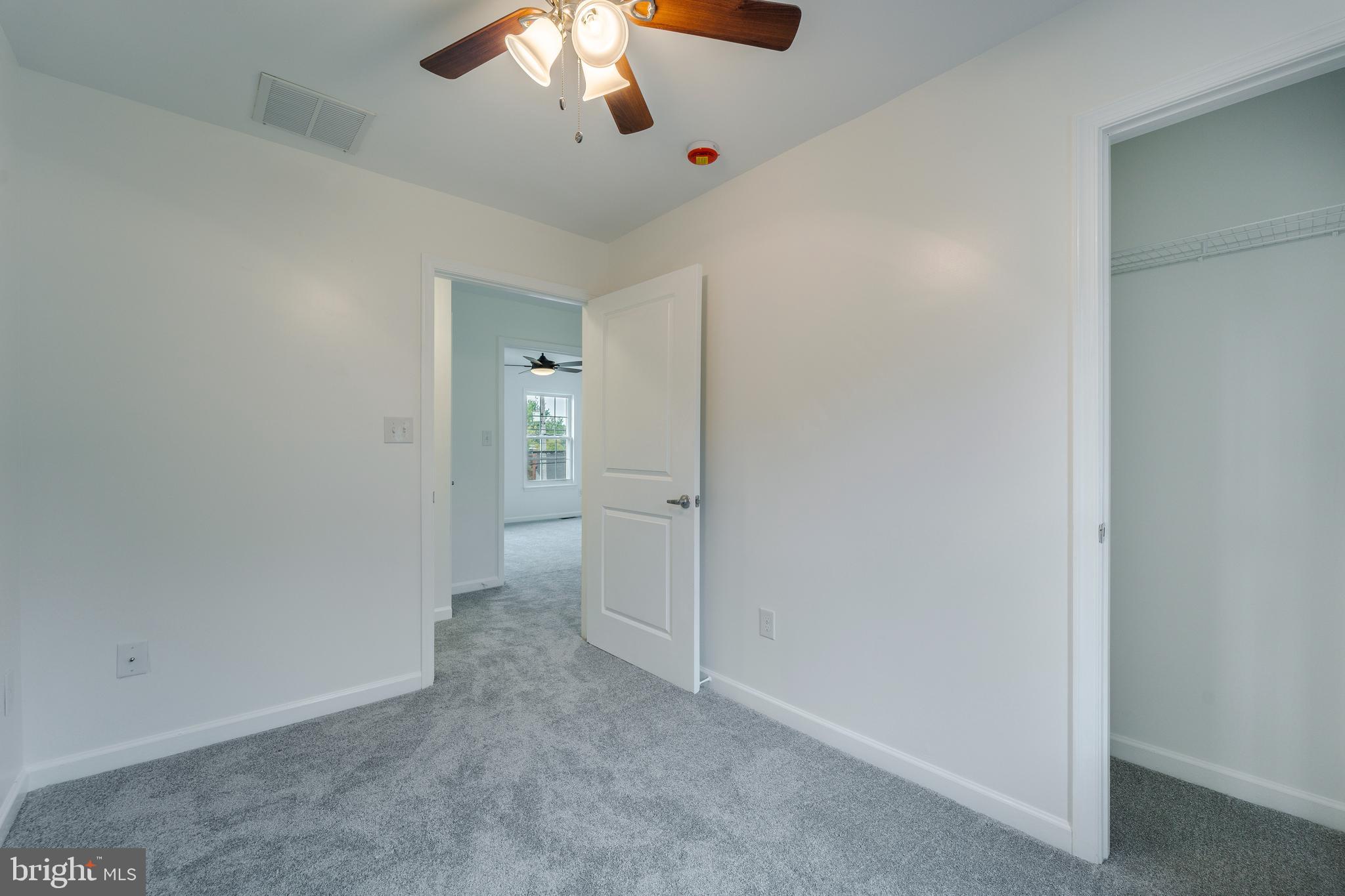 807 Washington Road Westminster, MD 21157 - Photo 20 of 32 an empty room with chandelier fan