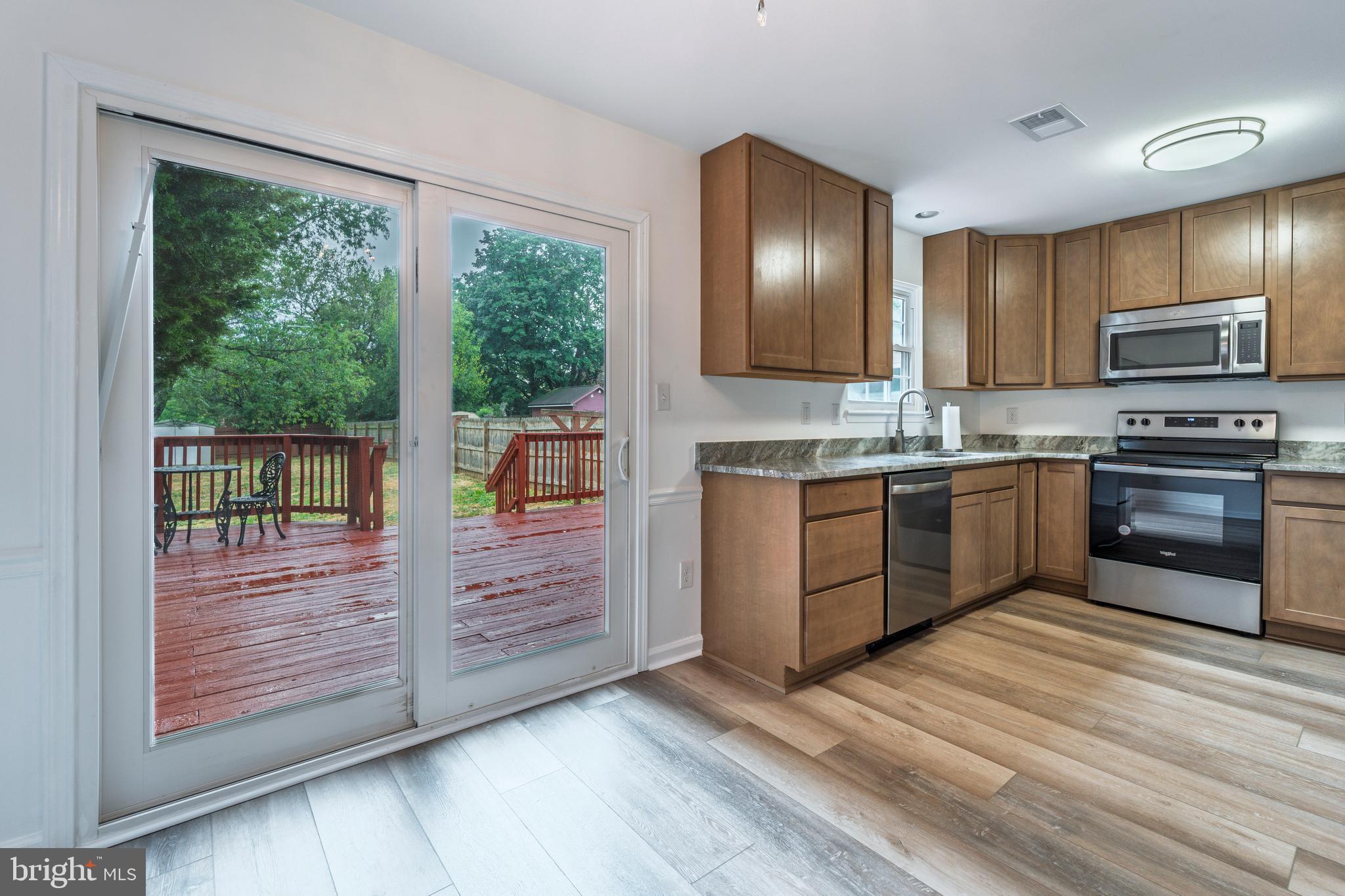 807 Washington Road Westminster, MD 21157 - Photo 9 of 32 a kitchen with stainless steel appliances granite countertop a stove a sink and a refrigerator