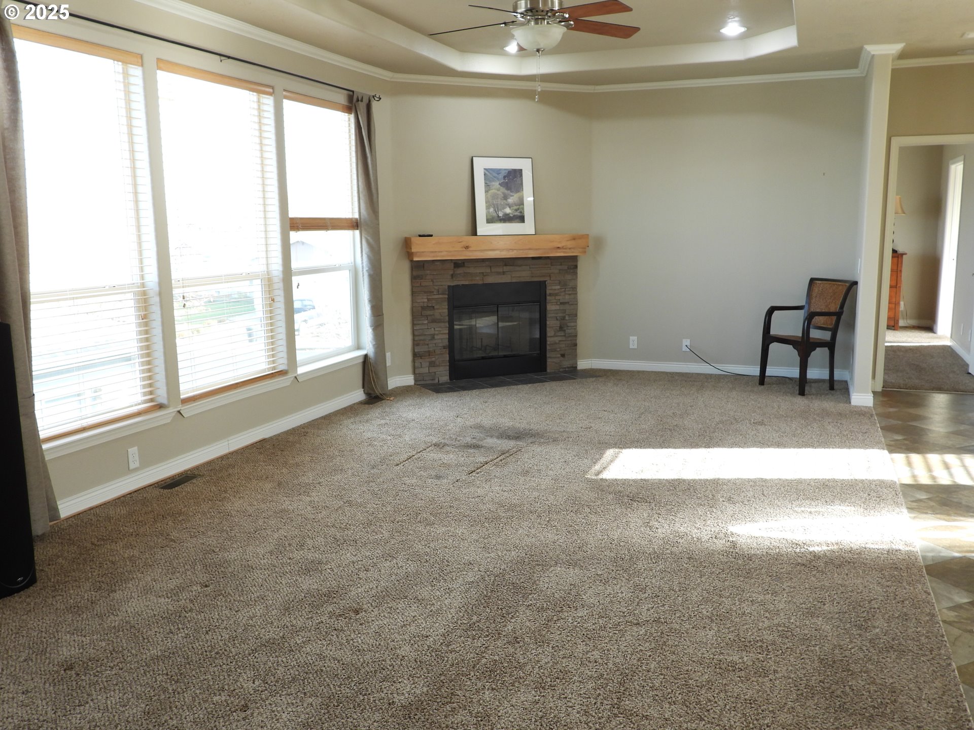 1903 Golden Way The Dalles, OR 97058 - Photo 14 of 22 an empty room with furniture and a fireplace