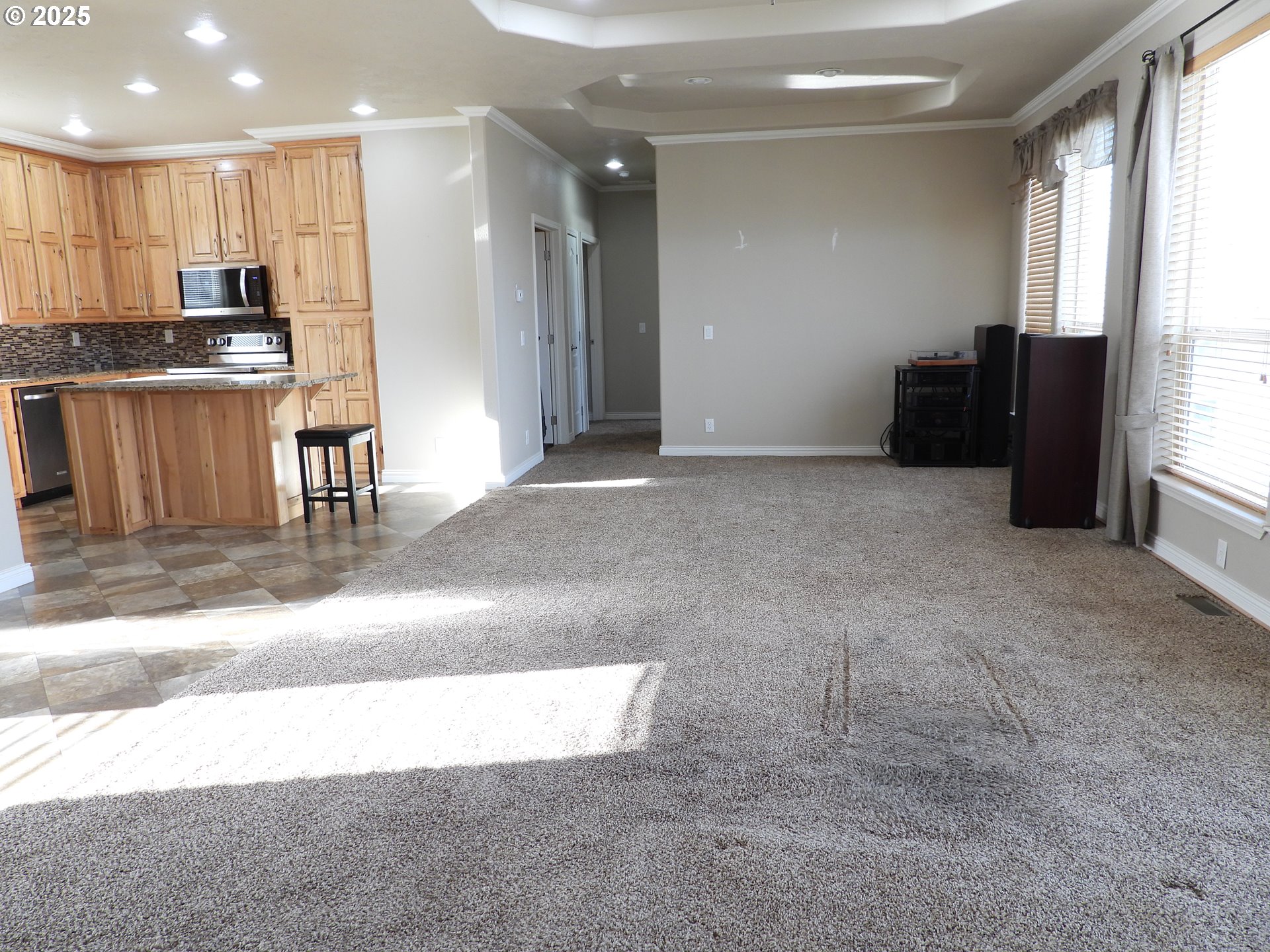 1903 Golden Way The Dalles, OR 97058 - Photo 17 of 22 a view of kitchen with kitchen island granite countertop a stove and a refrigerator