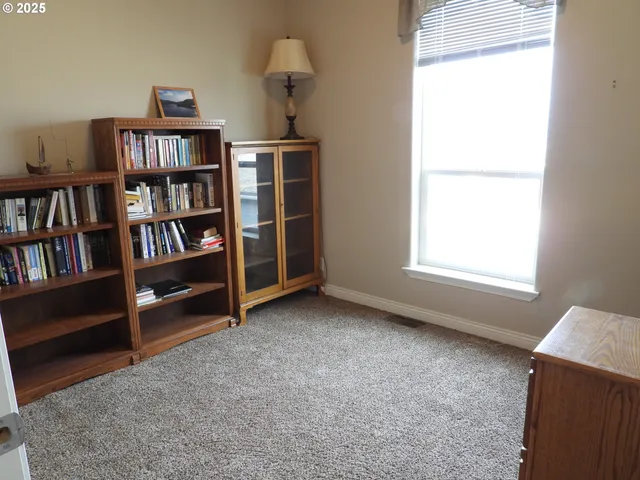 a view of an empty room with shelves