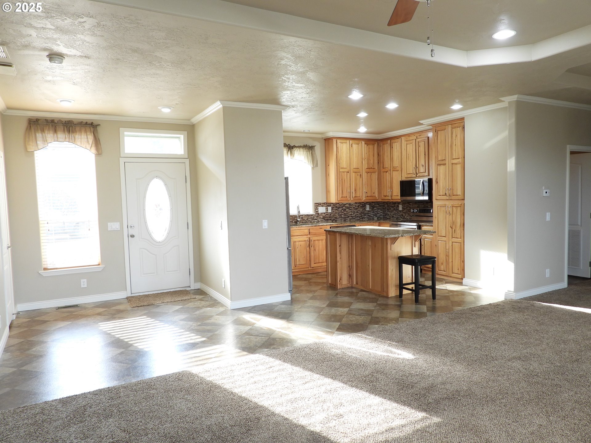 1903 Golden Way The Dalles, OR 97058 - Photo 6 of 22 a view of a kitchen with a sink a refrigerator and a window