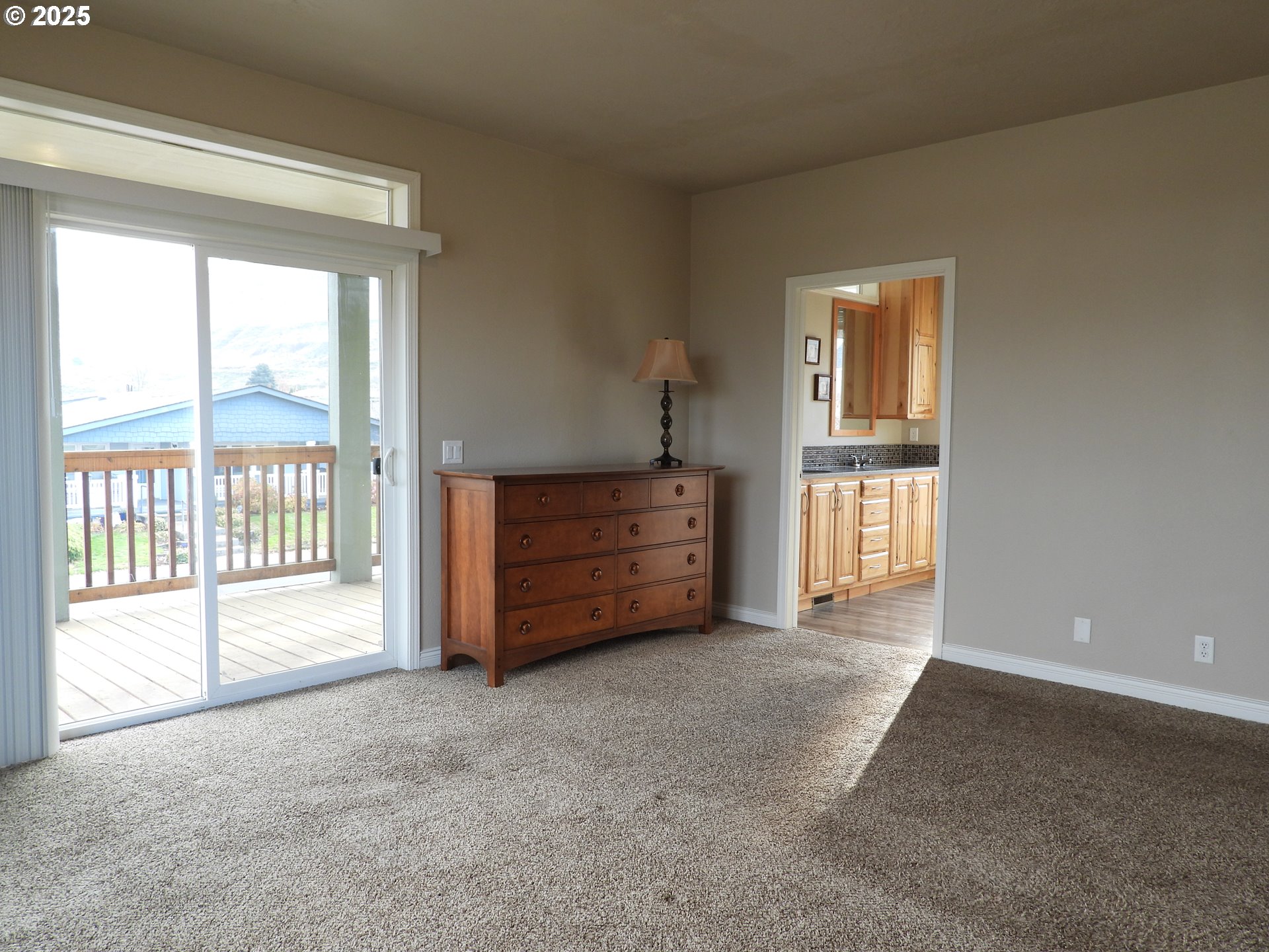 1903 Golden Way The Dalles, OR 97058 - Photo 9 of 22 a view of room with cabinet and windows