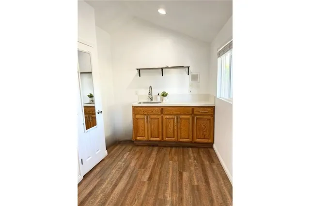 a kitchen with a sink and cabinets