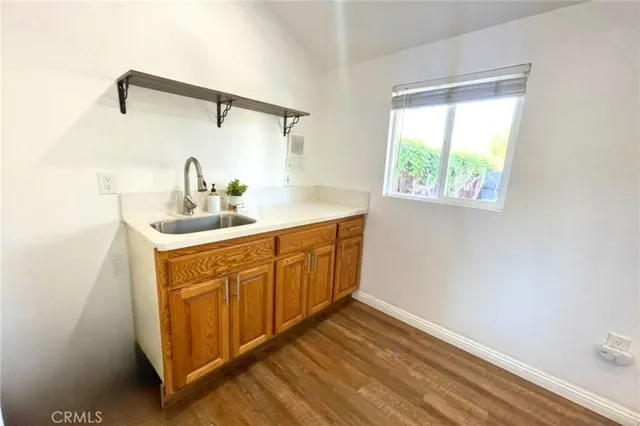 a utility room with sink dryer and washer