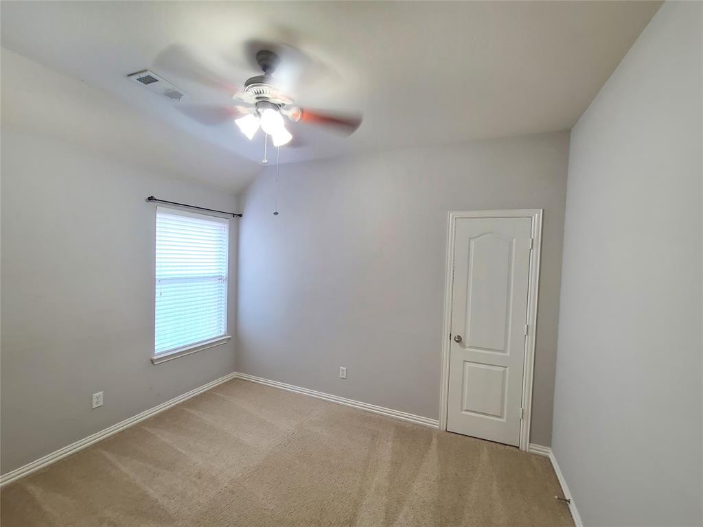 9729 Stripling Drive Fort Worth, TX 76244 - Photo 16 of 40 a view of a livingroom with a ceiling fan and window