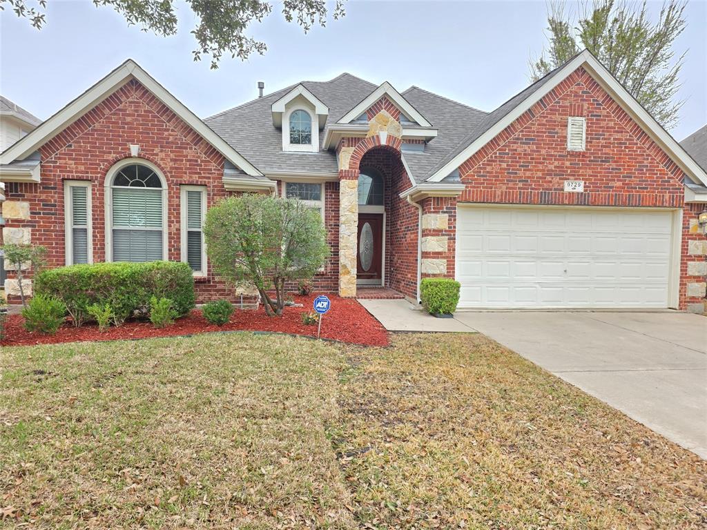 9729 Stripling Drive Fort Worth, TX 76244 - Photo 2 of 40 a front view of a house with garden