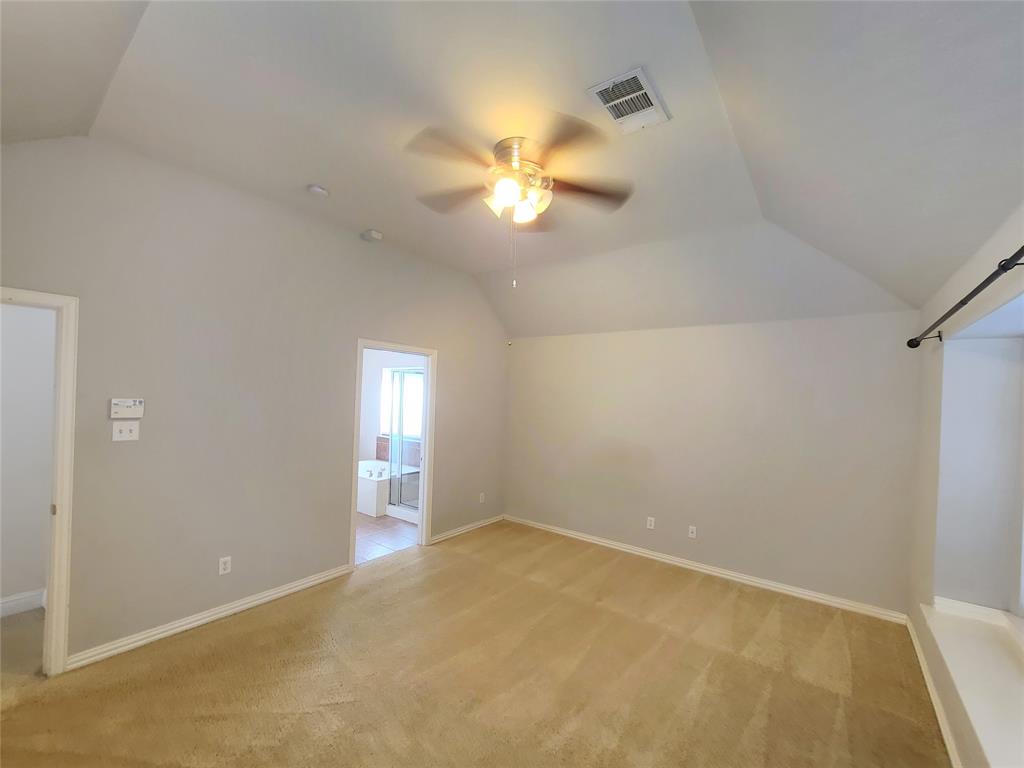 9729 Stripling Drive Fort Worth, TX 76244 - Photo 24 of 40 an empty room with closet and a chandelier fan