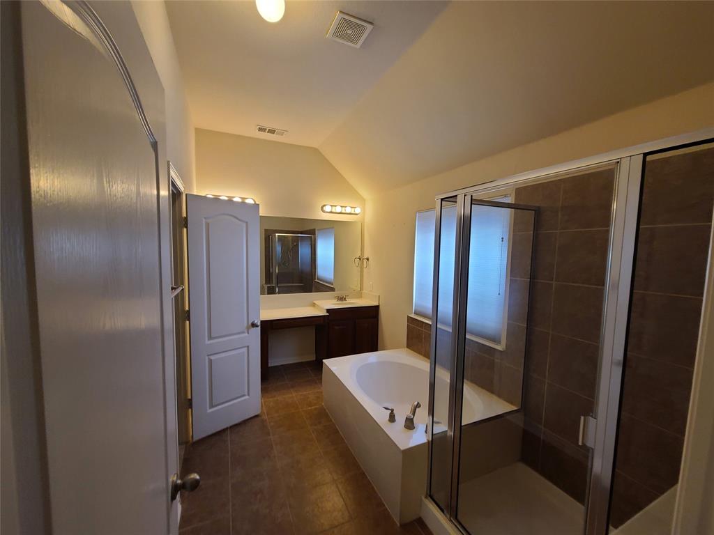 9729 Stripling Drive Fort Worth, TX 76244 - Photo 26 of 40 a view of kitchen with sink refrigerator and fireplace