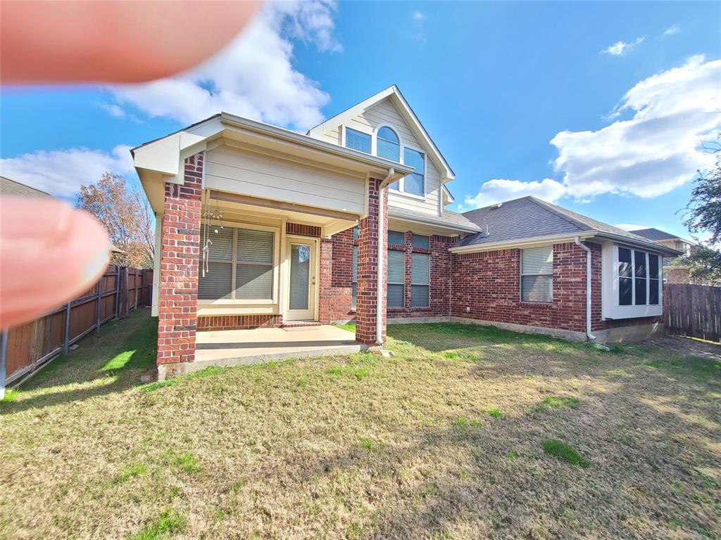 9729 Stripling Drive Fort Worth, TX 76244 - Photo 36 of 40 a front view of a house with a garden
