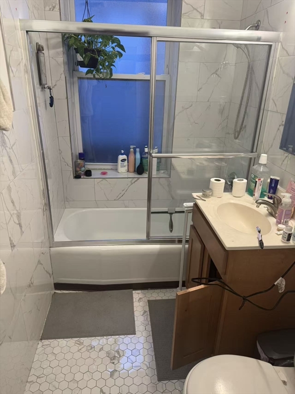 65-65A Beach Street Boston, MA 02111 - Photo 5 of 13 a bathroom with a sink and a mirror