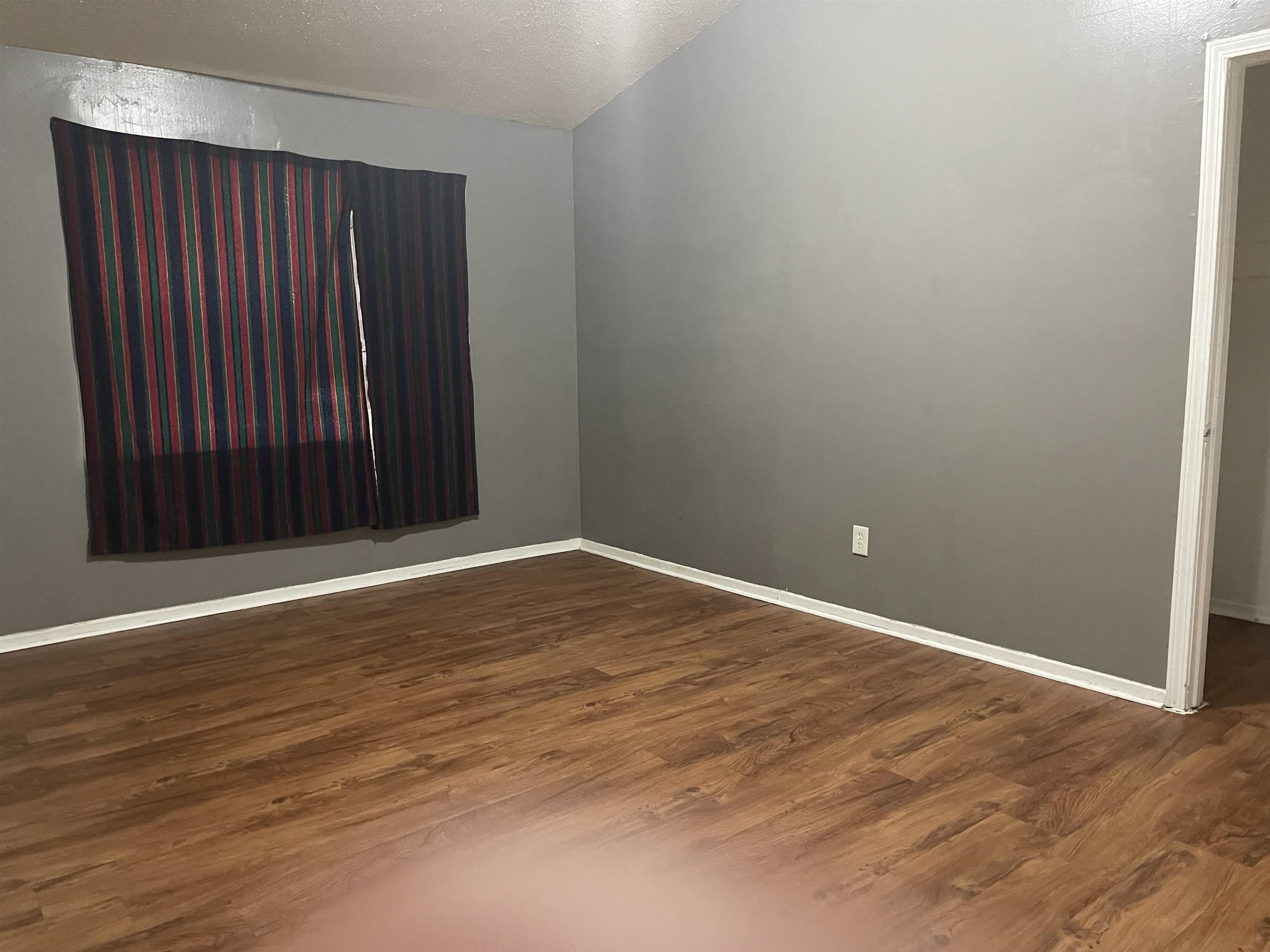 3312 Powell Avenue Memphis, TN 38122 - Photo 11 of 15 an empty room with wooden floor