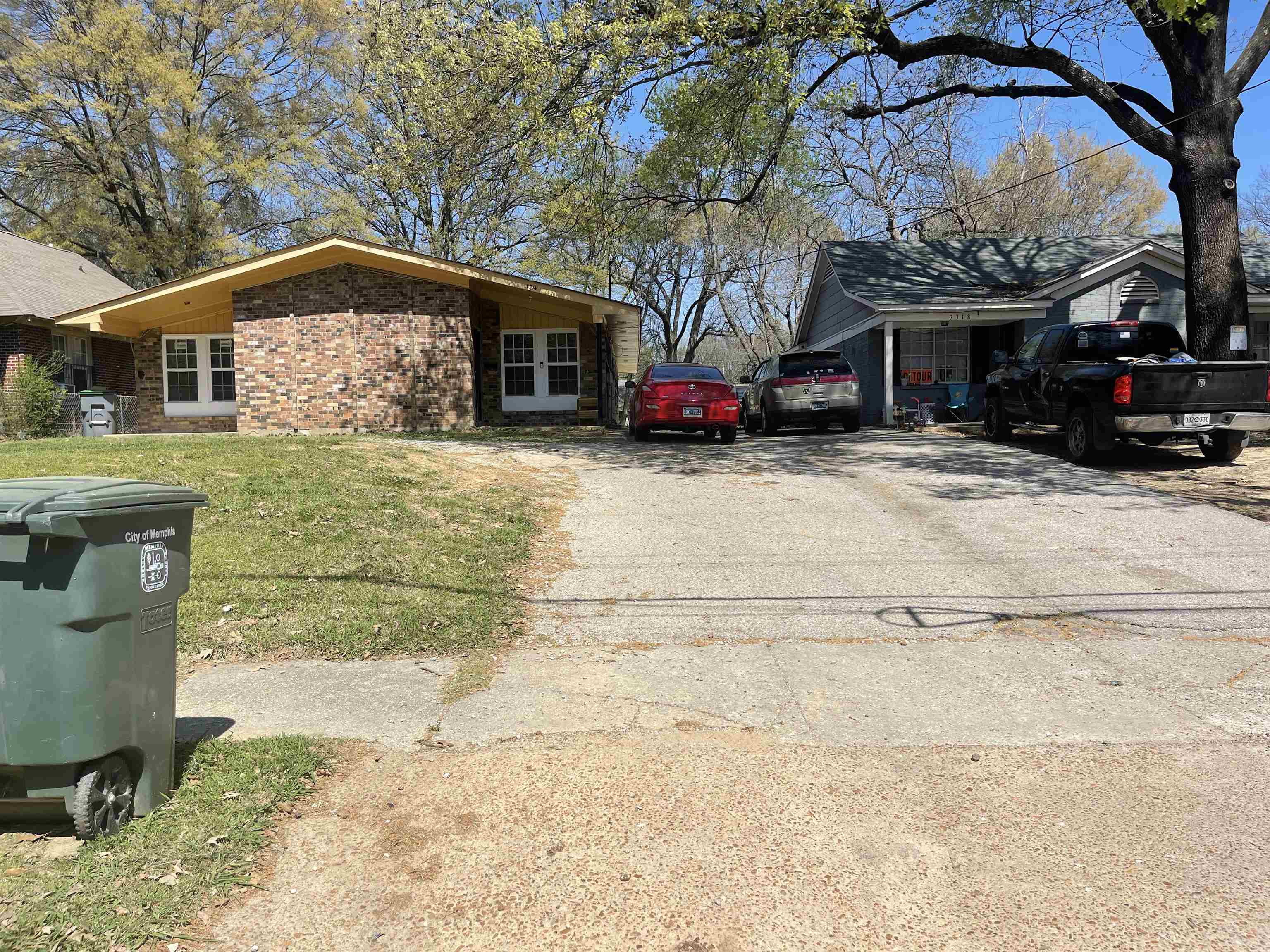 3312 Powell Avenue Memphis, TN 38122 - Photo 2 of 15 a front view of a house with a yard and garage