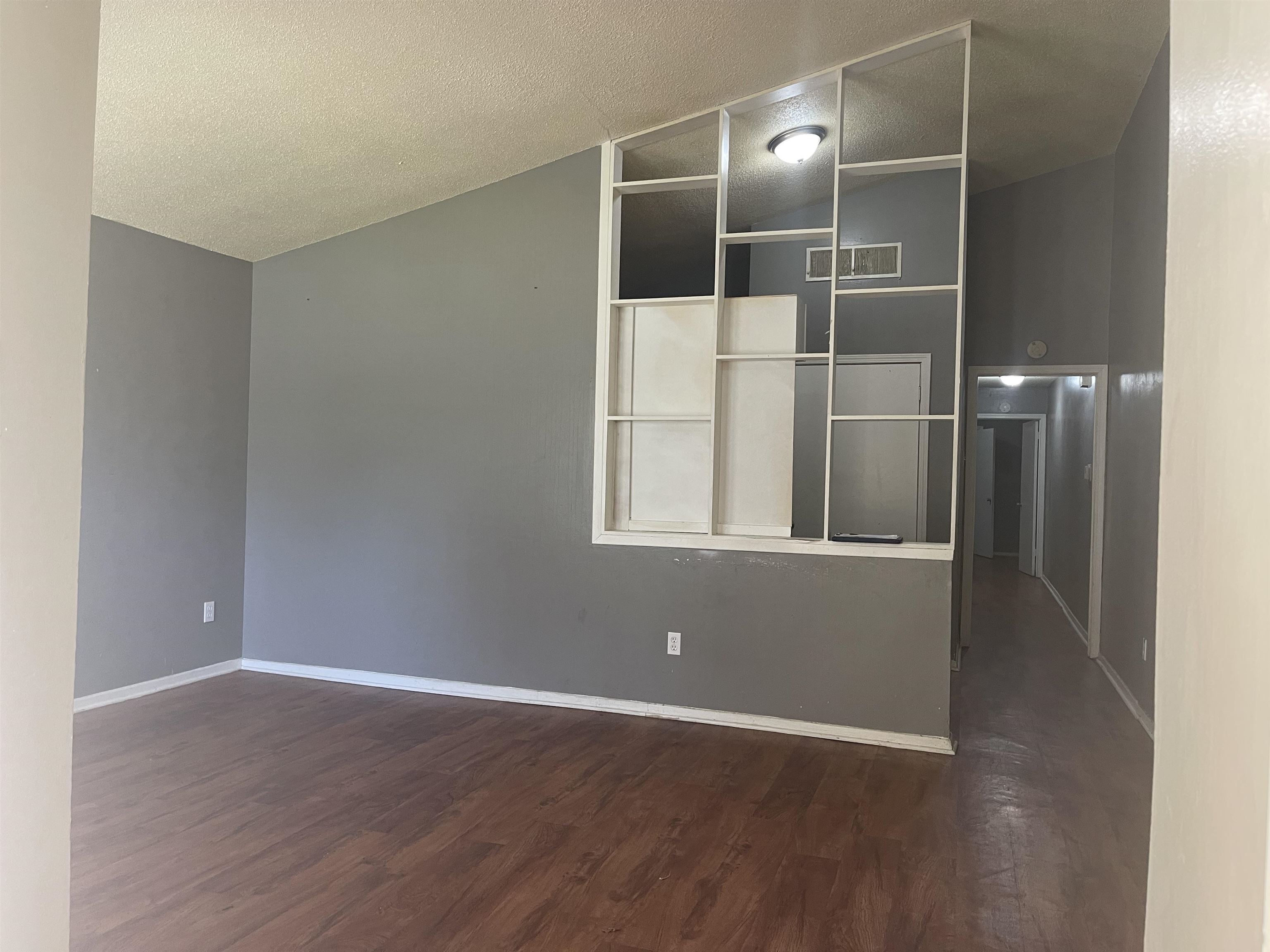 3312 Powell Avenue Memphis, TN 38122 - Photo 4 of 15 a view of empty room with wooden floor and fan