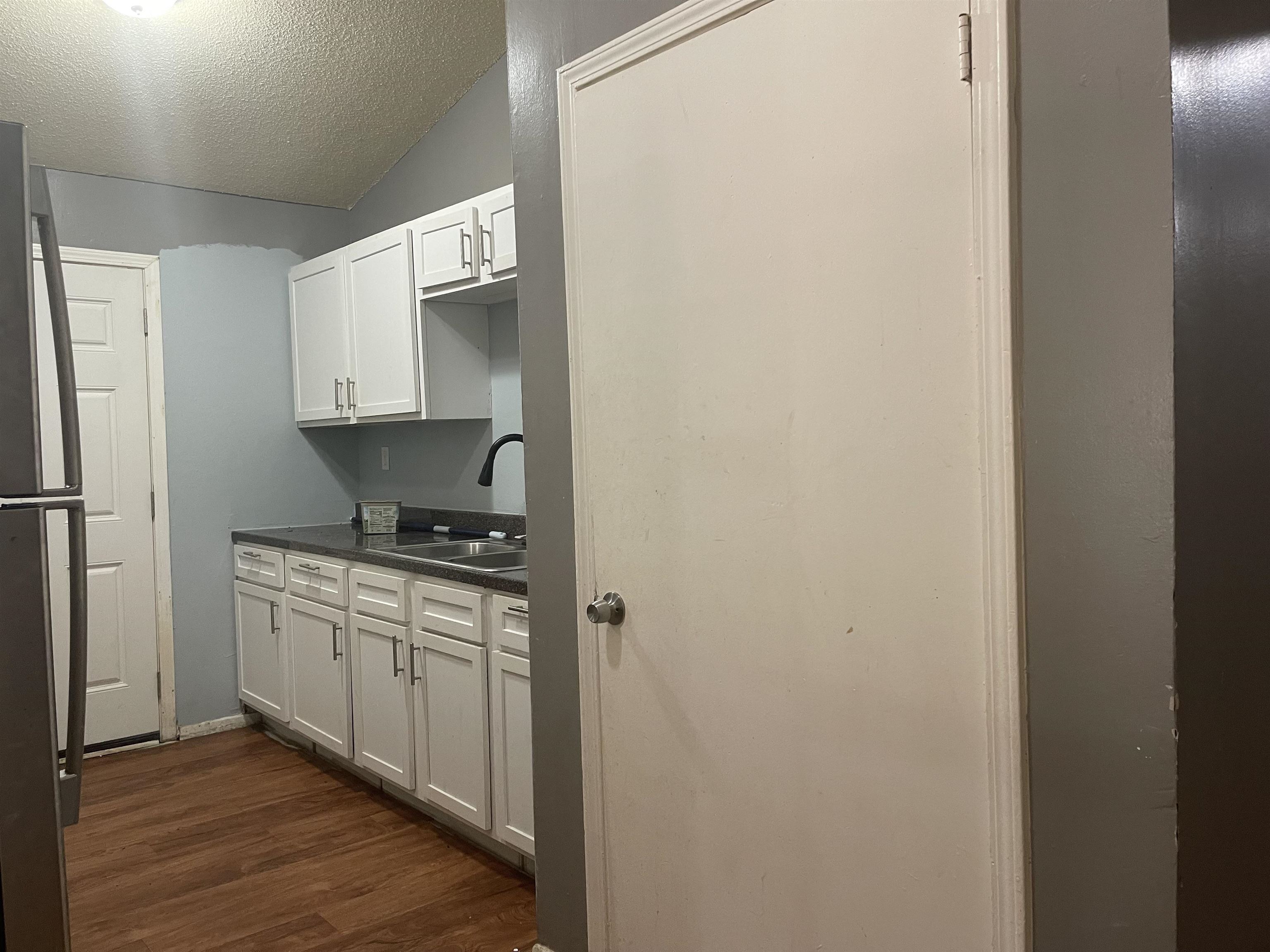 3312 Powell Avenue Memphis, TN 38122 - Photo 6 of 15 a kitchen with stainless steel appliances a sink and a refrigerator