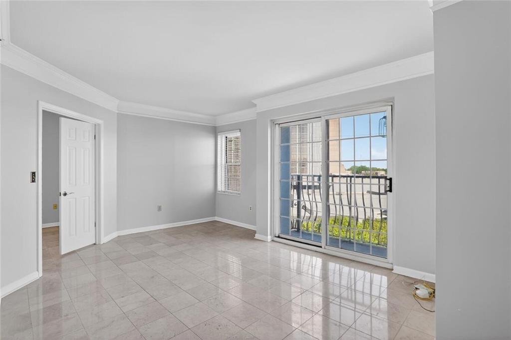 199 14th Street Northeast, Unit 711 Atlanta, GA 30309 - Photo 5 of 22 wooden floor in an empty room with a window