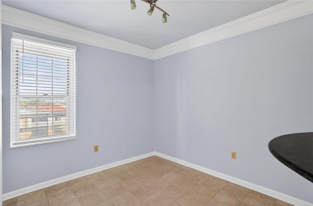 199 14th Street Northeast, Unit 711 Atlanta, GA 30309 - Photo 9 of 22 an empty room with a window