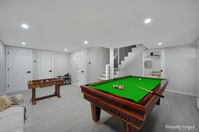 a room with furniture and pool table