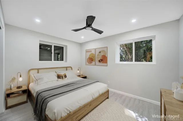 a bedroom with a large bed and a window