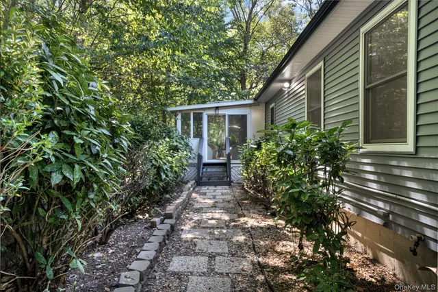 a backyard of a house with lots of green space