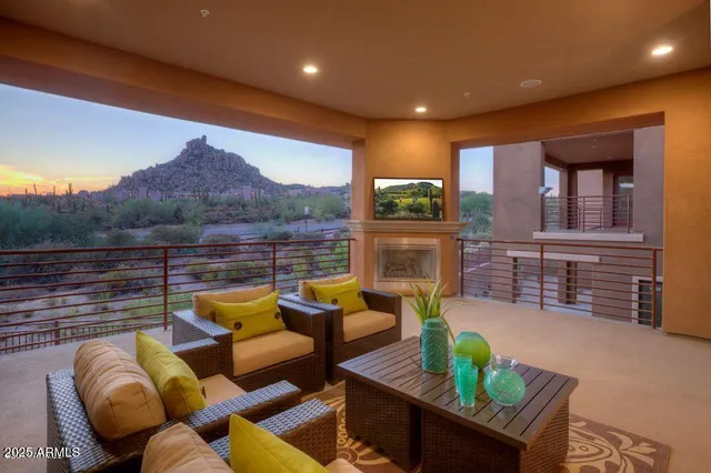 a view of a patio with a table and a fireplace