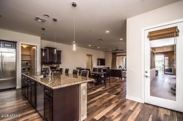 a view of a dining room with furniture window and wooden floor