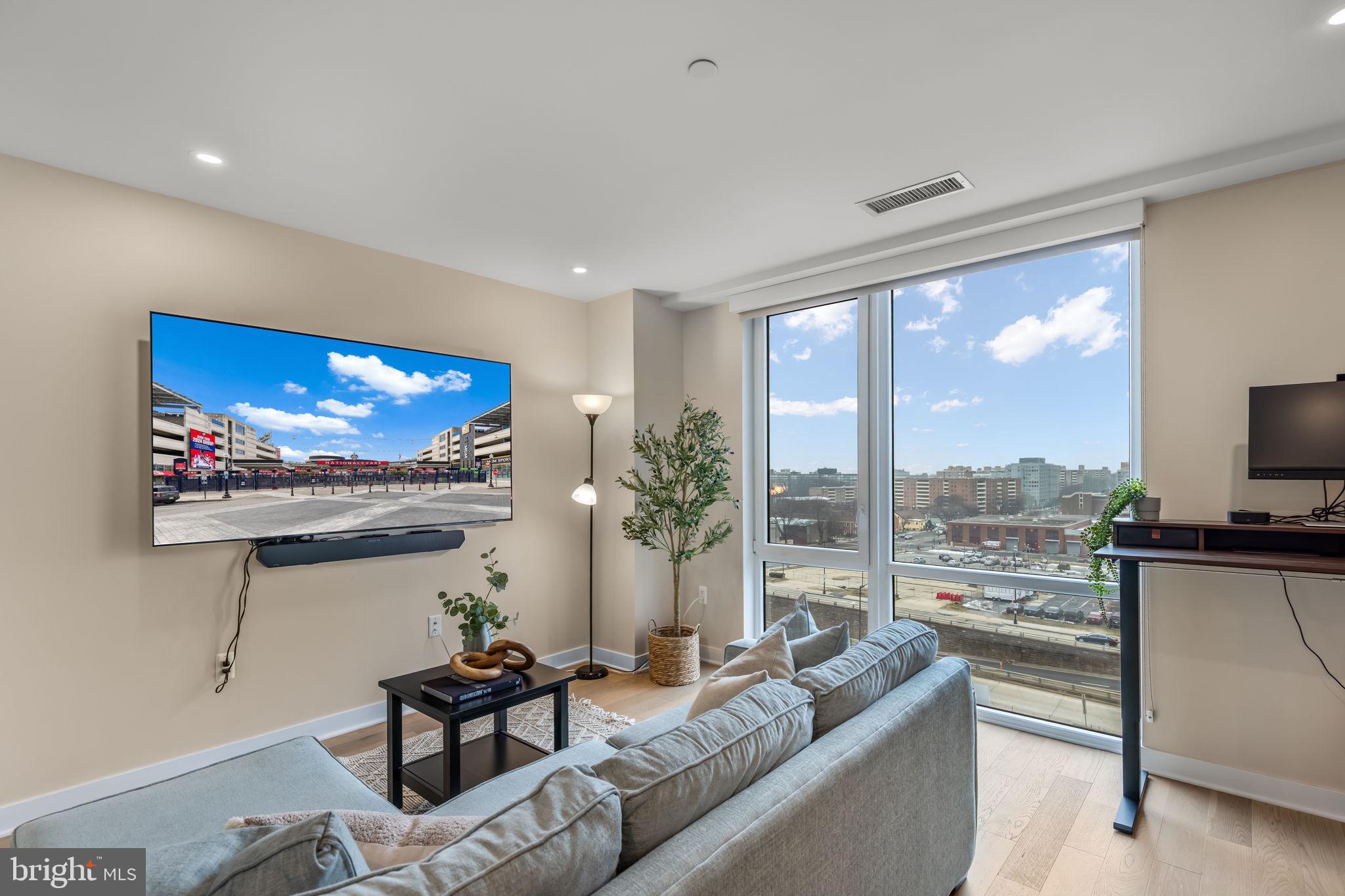 37 L Street Southeast, Unit 803 Washington, DC 20003 - Photo 11 of 46 Sunny living/dining area w floor to ceiling window