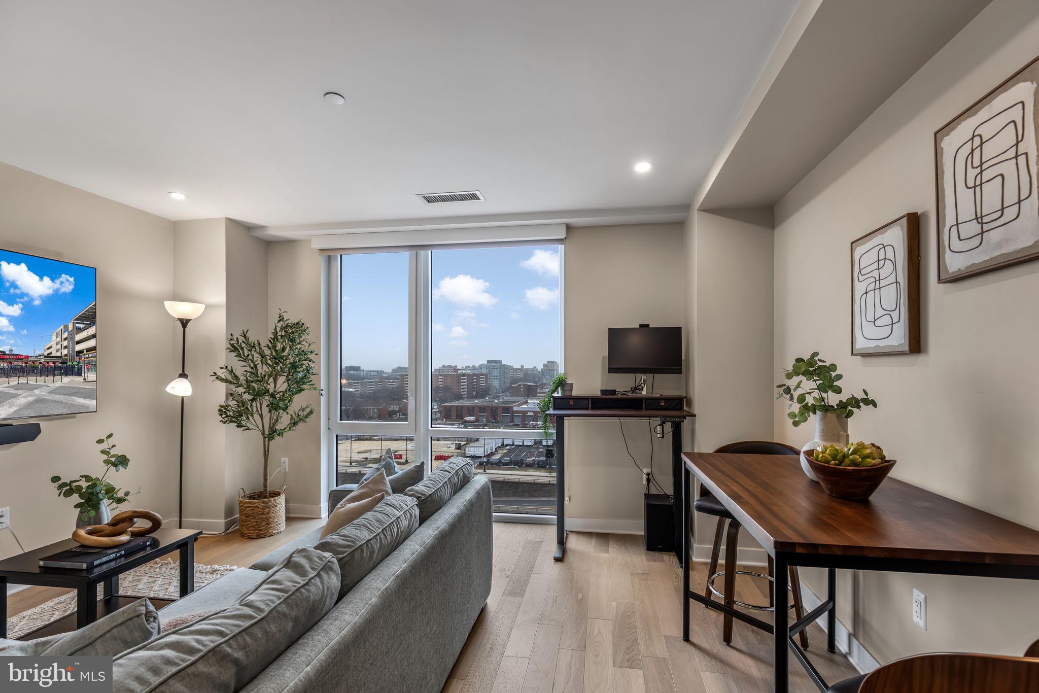 37 L Street Southeast, Unit 803 Washington, DC 20003 - Photo 12 of 46 Sunny living/dining area w floor to ceiling window