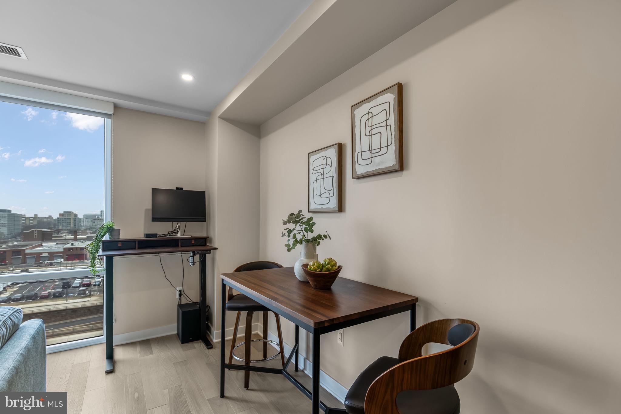 37 L Street Southeast, Unit 803 Washington, DC 20003 - Photo 13 of 46 Sunny living/dining area w floor to ceiling window