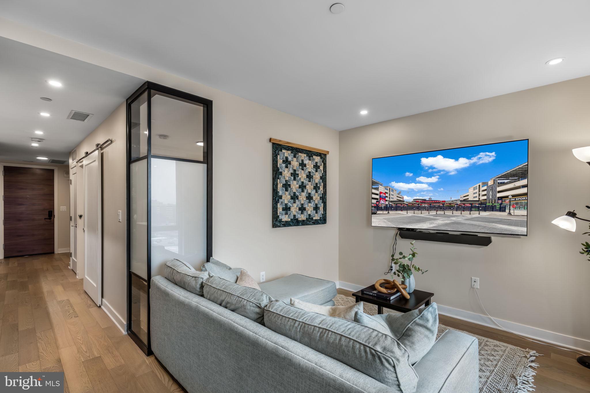 37 L Street Southeast, Unit 803 Washington, DC 20003 - Photo 15 of 46 Sunny living/dining area w floor to ceiling window