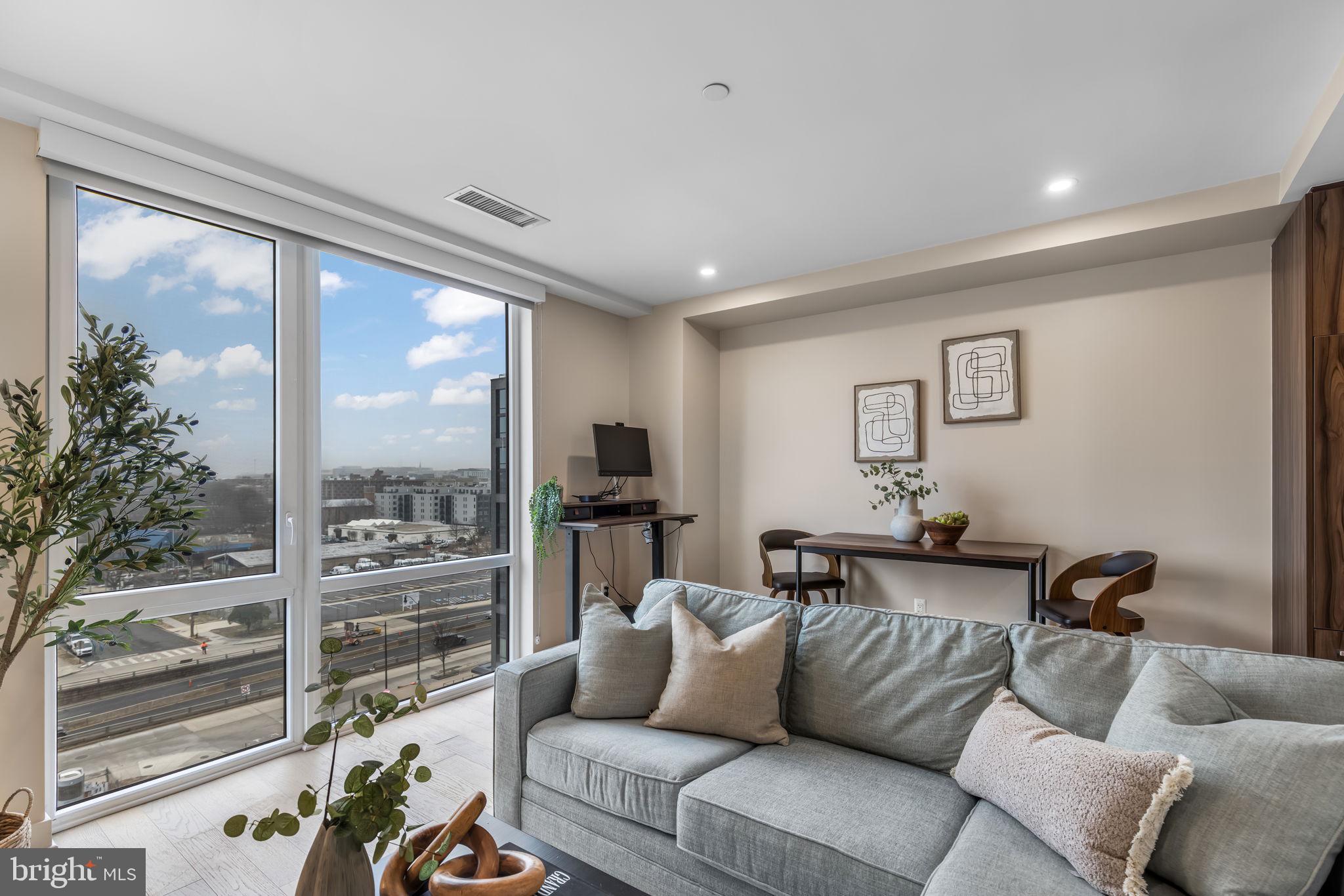 37 L Street Southeast, Unit 803 Washington, DC 20003 - Photo 2 of 46 Sunny living/dining area w floor to ceiling window