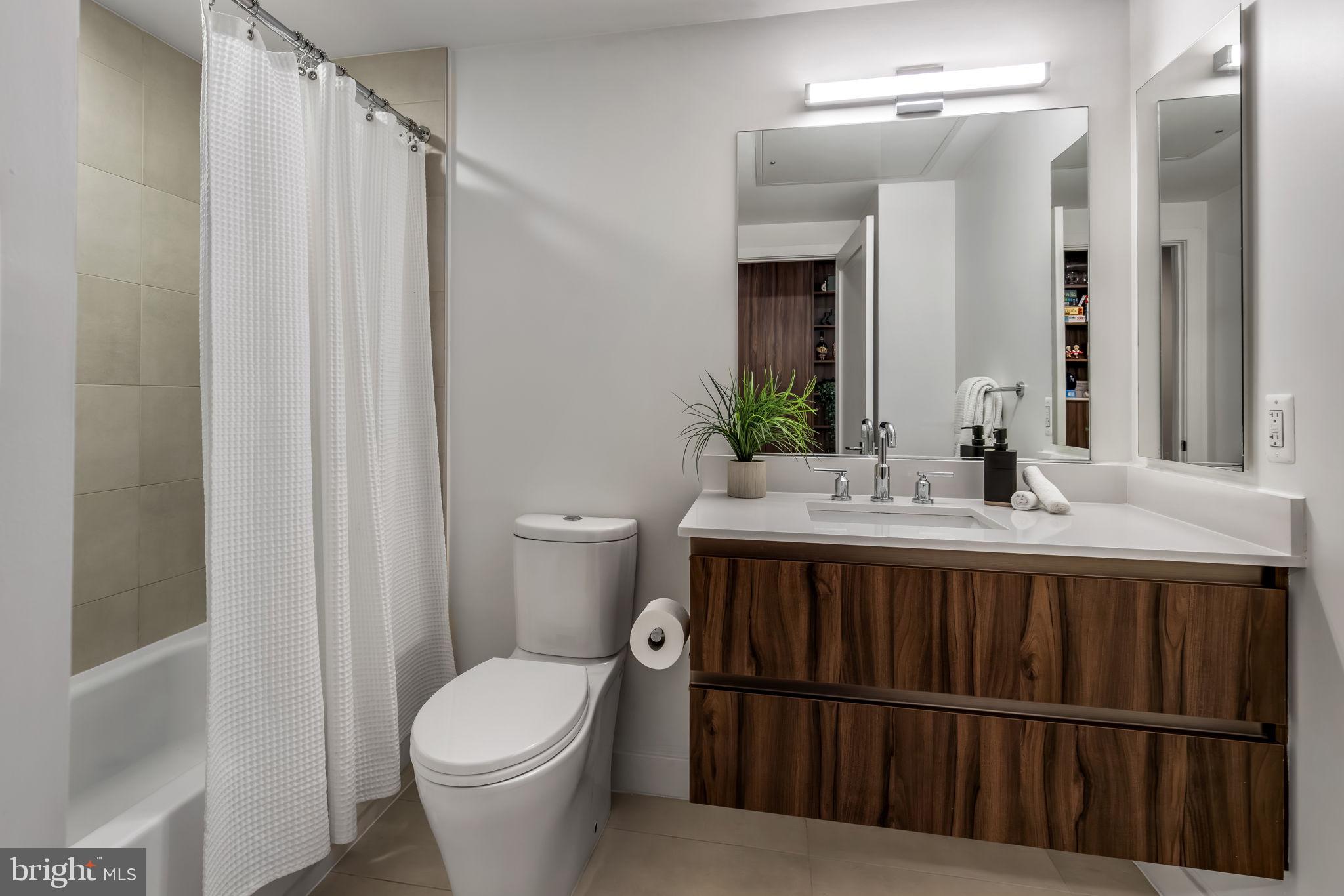 37 L Street Southeast, Unit 803 Washington, DC 20003 - Photo 21 of 46 Full bath with floating vanity and tub shower!