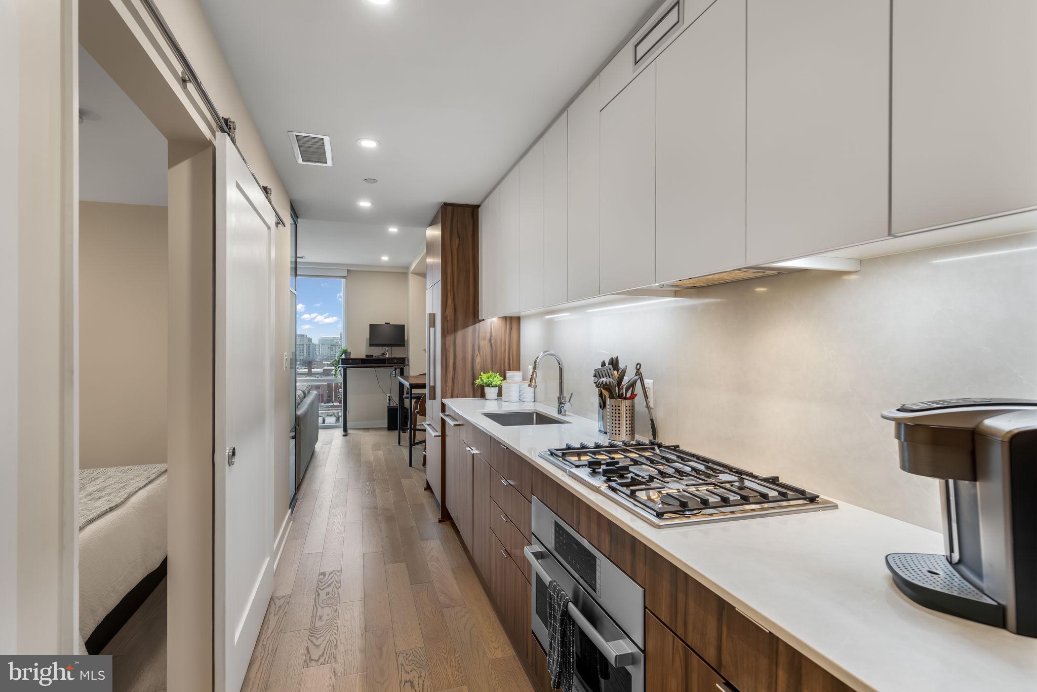 37 L Street Southeast, Unit 803 Washington, DC 20003 - Photo 3 of 46 Sleek kitchen with posh, contemporary finishes!