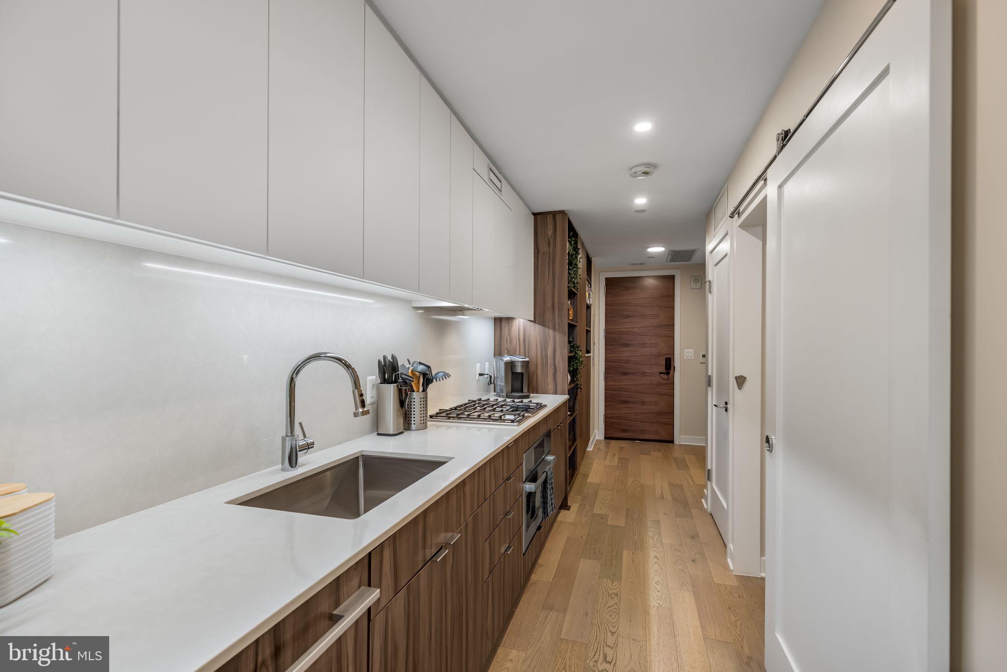 37 L Street Southeast, Unit 803 Washington, DC 20003 - Photo 9 of 46 Sleek kitchen with posh, contemporary finishes!