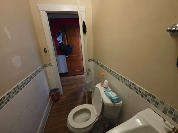 a bathroom with a toilet and a sink