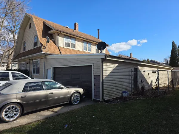 a car parked in front of a house