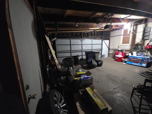 a bedroom with a bed and wall painting