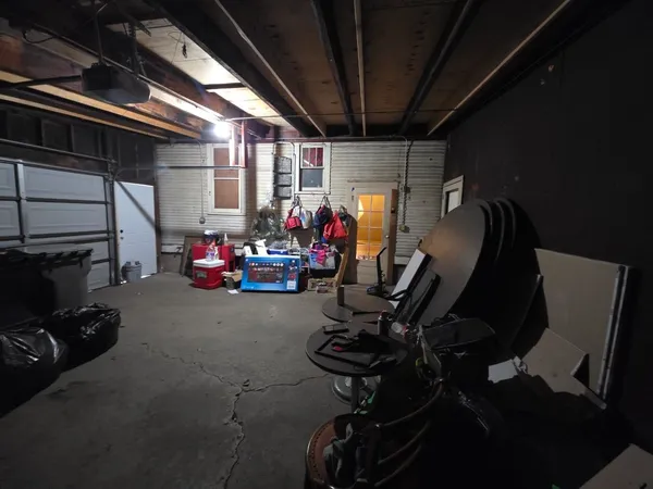 a bedroom with a bed and a flat tv screen