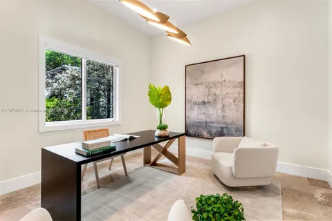 a spacious bedroom with a bed and a large window