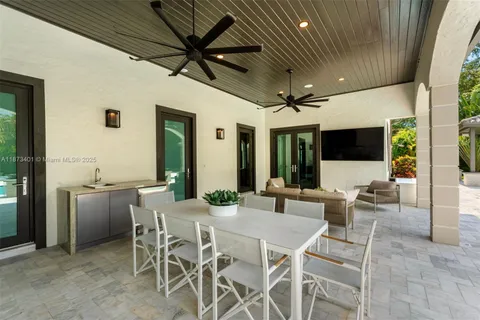 a kitchen with a stove sink and microwave