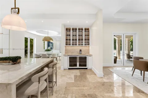 a living room with furniture a flat screen tv and a window