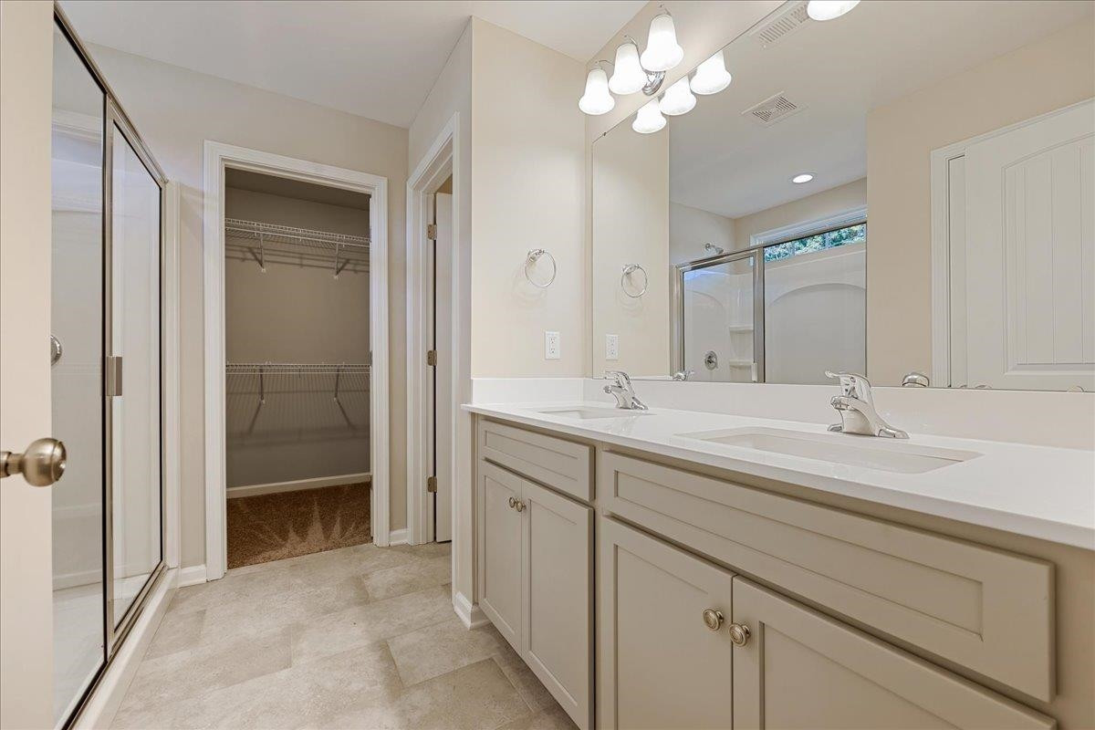 2178 Campbell Loop Burlington, NC 27215 - Photo 15 of 30 a bathroom with a sink vanity and a mirror