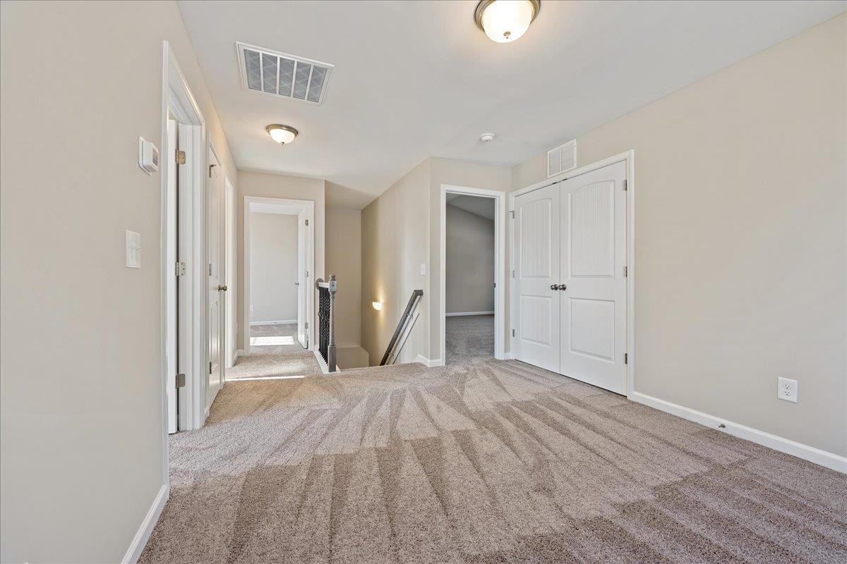 2178 Campbell Loop Burlington, NC 27215 - Photo 19 of 30 a view of empty room with wooden floor
