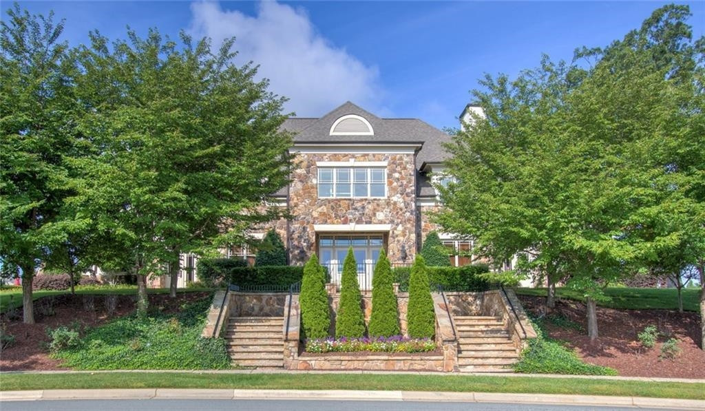 2178 Campbell Loop Burlington, NC 27215 - Photo 22 of 30 a front view of a house with a garden