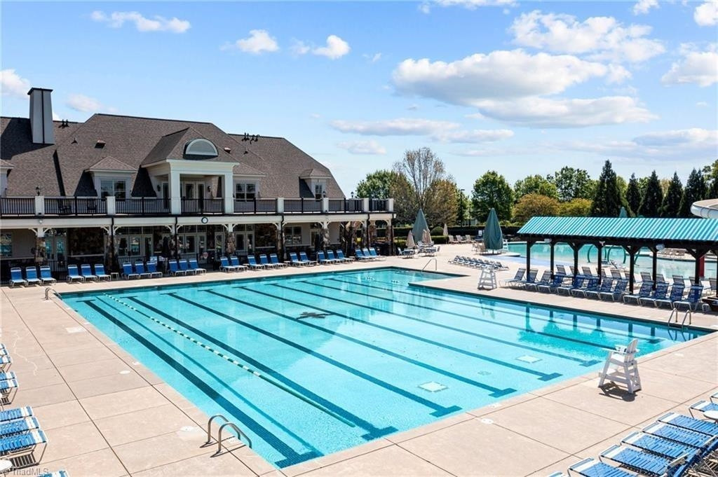 2178 Campbell Loop Burlington, NC 27215 - Photo 25 of 30 a view of a swimming pool with a lounge chairs