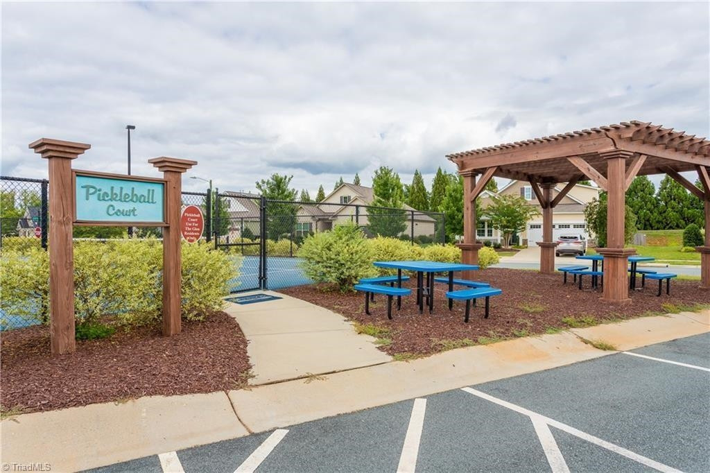 2178 Campbell Loop Burlington, NC 27215 - Photo 30 of 30 a view of a patio with a table and chairs under an umbrella